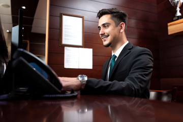 Receptionist distributing correspondence and redirecting phone calls
