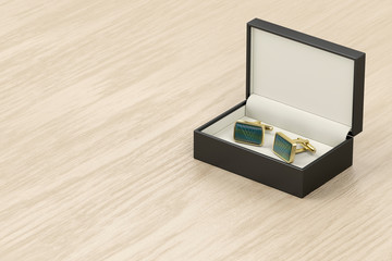 Box with golden cufflinks