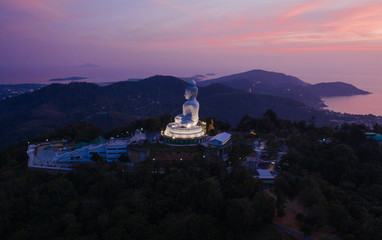 Big Buddha statue on the hill in Phuket Island Sunset Drone flight