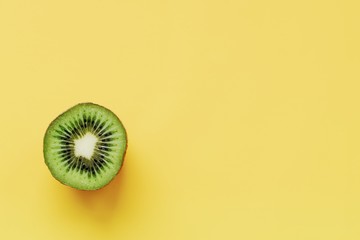 kiwi isolated on YELLOW background. fruits in advertising