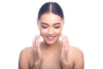 Obraz na płótnie Canvas Beautiful Young Asian Woman with Clean Fresh Skin isolate on white background. Spa, Face care, Facial treatment, Beauty and Cosmetics concept. Looking down, big smile.