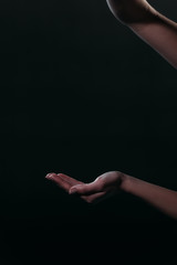 cropped view of self-destroyer going to commit suicide by overdosing medicines isolated on black