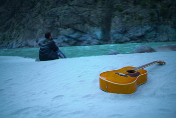 Guitar on a beach