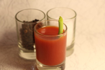 glass of tomato juice and tomato