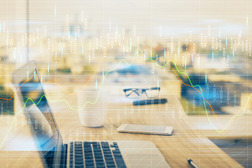 Obraz premium Financial market graph hologram and personal computer on background. Double exposure. Concept of forex.