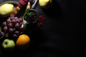 bowl with tobacco for hookah. fruits on a black background. smoking nargile