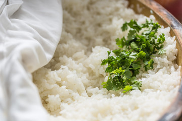 Cooked rice in a typical Japanese wooden vessel hangiri. Pile of rice before ready to prepare sushi