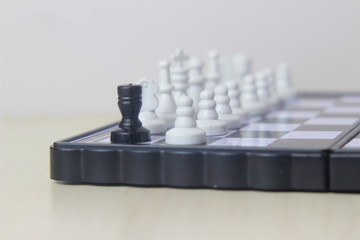 Simple Photo illustration for War, battle or politic situation concept, betrayer beyond the soldier, plastic magnetic small chess, 