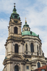 Fototapeta na wymiar The Church of Saint Nicholas (Malá Strana), Baroque church in the Lesser Town of Prague. Former Gothic church dedicated to Saint Nicholas, Prague Baroque
