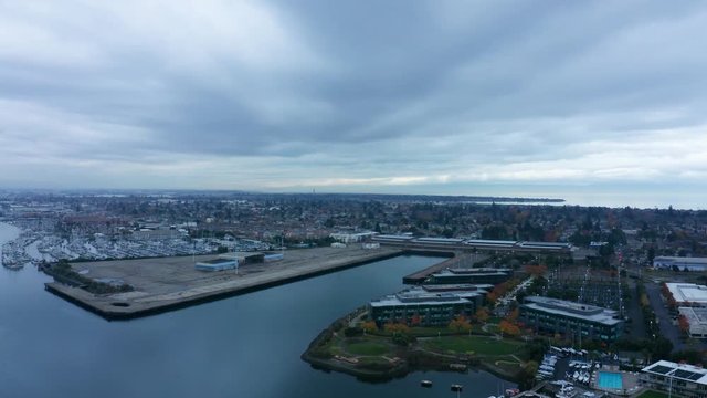 A long decent into the bay shipping port lane on a cloudy day in the bay with overcast skies.