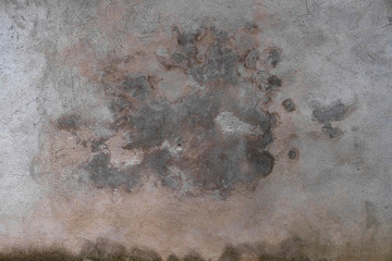 Abstract grunge texture of old colorful wall with cloud pattern. Creative background. Grey, orange, pink and brown beautiful rough weathered stone texture. Copy space