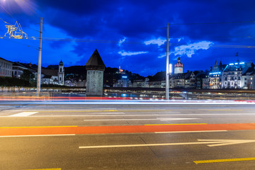 City Street and Chapel Bridge in Long Exposure at Night in Switzerland.