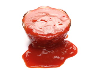 Tomato paste in glass bowl, organic pure texture, isolated on white background