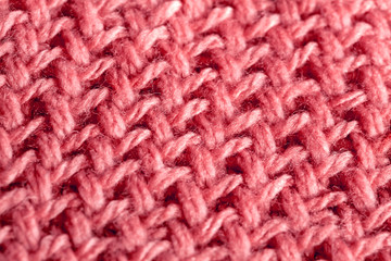 オレンジ系ピンクの模様編みニット編み地のテクスチャ　パターン
