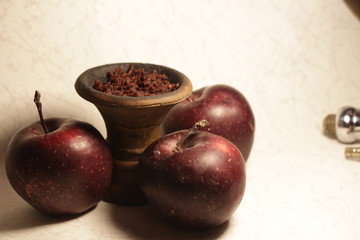 bowl with tobacco for hookah. fruits on a dark background. smoking nargile