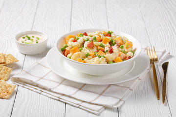 cauliflower salad with bacon, cheese, green peas