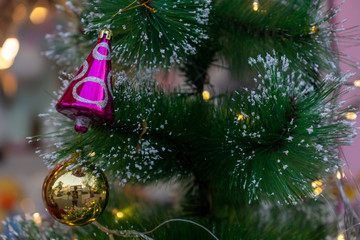 Snow covered the Christmas tree with a ball