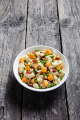 cauliflower salad in a white bowl, close-up