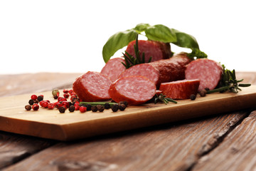 sausage slices, smoked meat product (tasty snack salami) menu concept. food background with cracow sausages
