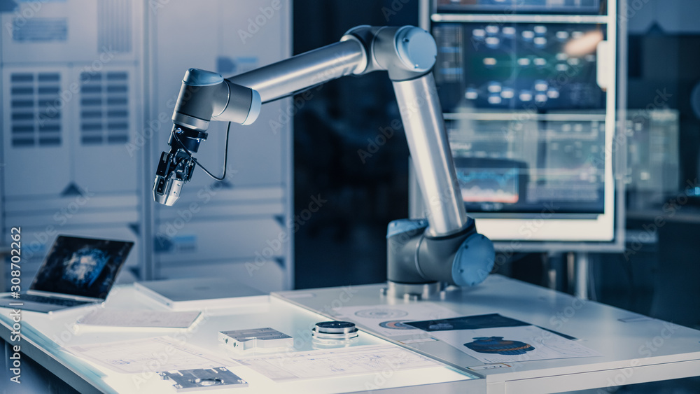 Poster futuristic artificial intelligence robotic arm operates and moves a metal object, picks it up and pu