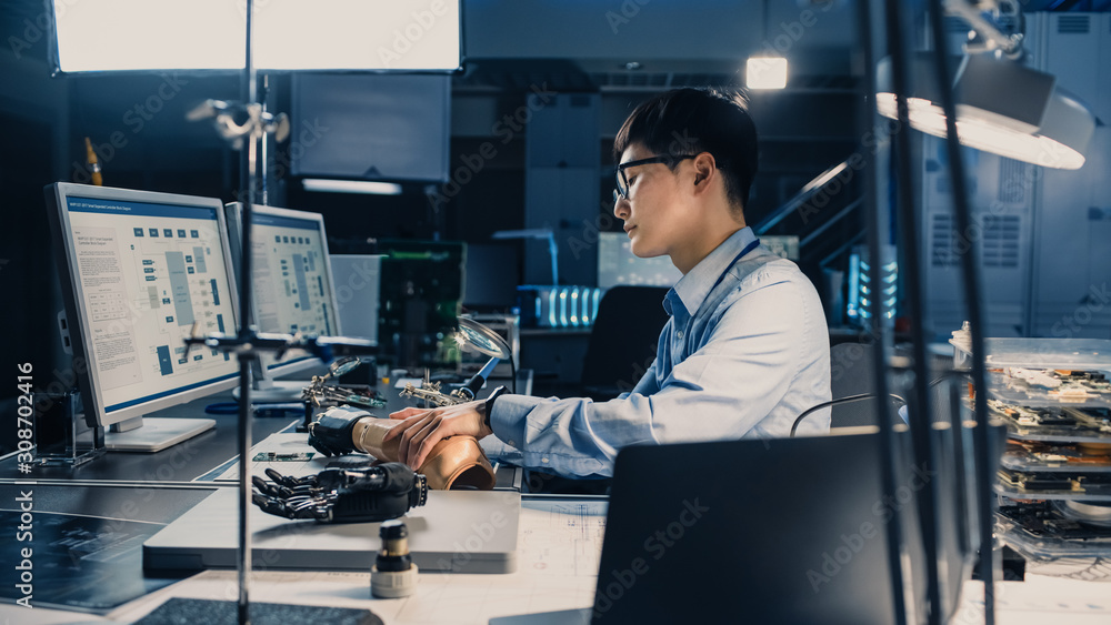 Poster futuristic prosthetic robot arm being tested by a professional japanese development engineer in a hi