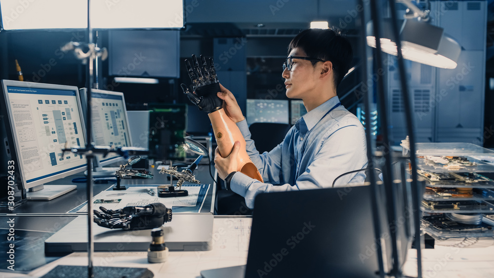 Aufkleber futuristic prosthetic robot arm being tested by a professional japanese development engineer in a hi