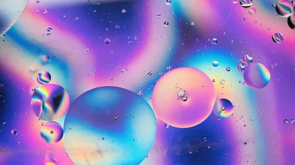 Oil drops in water. Abstract psychedelic pattern image rainbow colored. Abstract background with colorful gradient colors. DOF