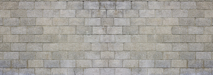 Large and dirty cinderblocks wall background or texture