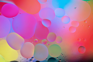 Oil drops in water. Abstract psychedelic pattern image rainbow colored. Abstract background with colorful gradient colors. DOF