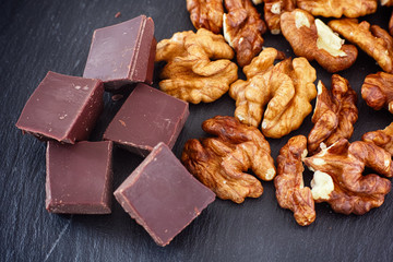 Broken dark chocolate and organic raw walnuts