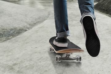 Fototapeta na wymiar Skateboarder skateboarding at skate park