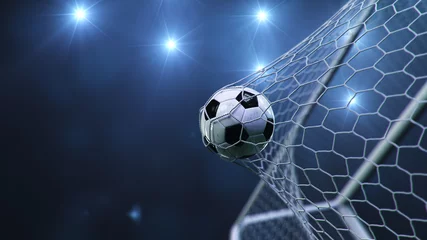 Foto op Plexiglas Bestsellers Sport Voetbal vloog in het doel. Voetbal buigt het net, tegen de achtergrond van lichtflitsen. Voetbal in doel netto op blauwe achtergrond. Een moment van verrukking. 3D illustratie