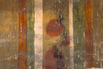 Grungy colorful vintage painted wall with lines, stripes. Very old paint background with plaster...