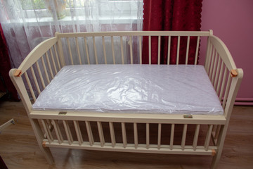 baby crib without bedding,to prepare for the birth of a baby, the bed was folded with a mattress