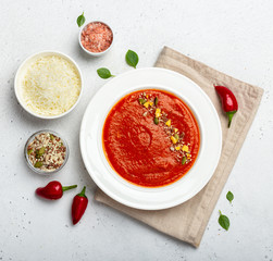 Warm homemade pureed tomato soup shot from above