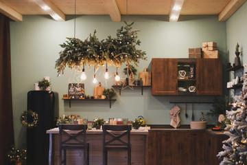 Festive interior in Christmas decorations. modern living room or dining room. Beautiful New Year...