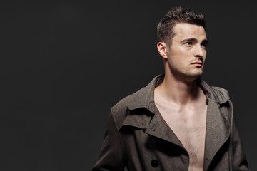 Obraz premium portrait of young man in black shirt and jeans