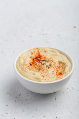 Hummus in a white bowl