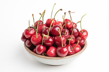 Fresh Red Cherries In A Small Round Stoneware Bowl