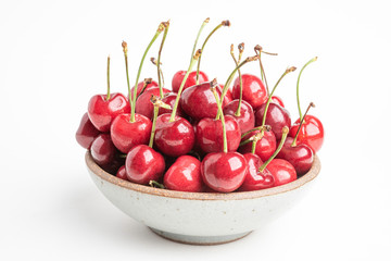 Fresh Red Cherries In A Small Round Stoneware Bowl