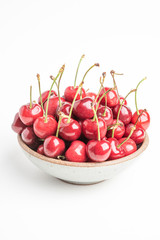 Fresh Red Cherries In A Small Round Stoneware Bowl