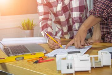 engineer meeting for architectural project, working with partner and engineering tools at workplace. Architect working on blueprint. Construction concept.