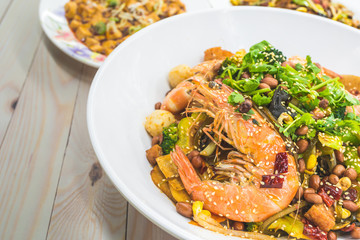 Mala Xiang Guo (stir-fry pot). Chongqing Sichuan Spicy Fragrant Pot. Oily, spicy, and numbing Chinese sauce which consists of peppercorn, chili pepper and various spices simmered with red oil.