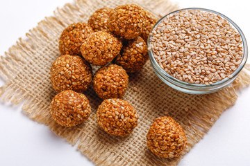 Til Gul OR Sweet Sesame Laddu for Indian festival Makar Sankranti over white background 