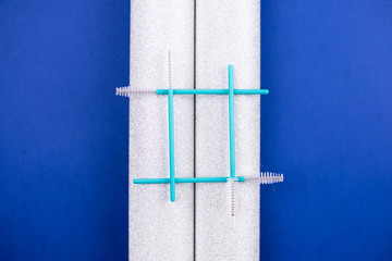 Hashtag made from cosmetic brushes for eyelashes in classic blue color.