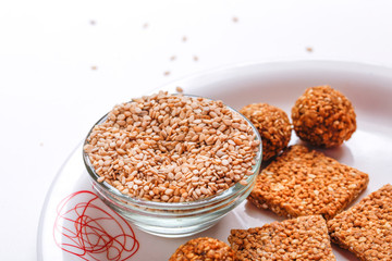 Til Gul OR Sweet Sesame Laddu for Indian festival Makar Sankranti over white background 