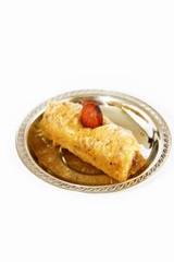 traditional oriental turkish arabic sweet baklava on a decorative plate