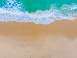 Fototapeta na wymiar White sand beach turquoise sea wave aerial view copy space