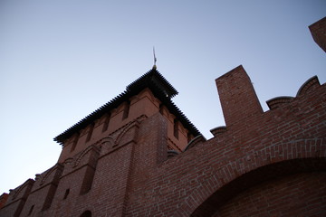 Fototapeta premium One of the towers of the Tula Kremlin Russia. Bottom view. Close-up of the old brick guard tower of 1146. Architectural landscape