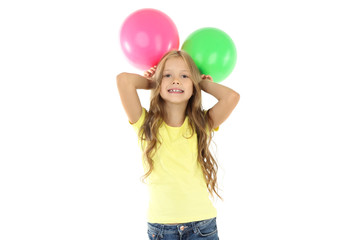 Pretty little girl with rubber balloons on white background
